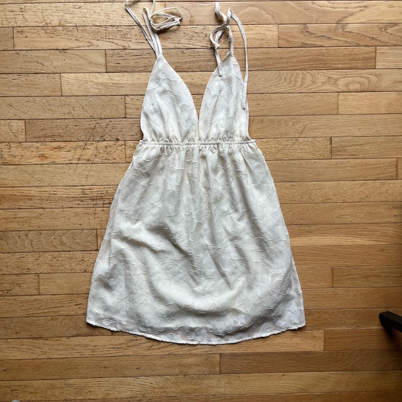 Dresses & Skirts - Off White floral mini dress. With tie straps.